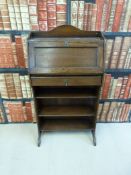 A small oak student's bureau and child's chair