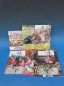 A collection of signed Arsenal programmes and a signed England record