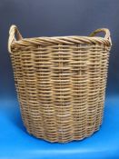 A large two handled log basket