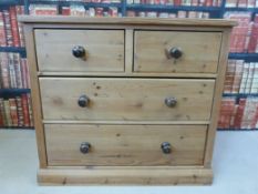 Pine chest of two over two drawers (H 81cm x W 91cm x D 53cm)