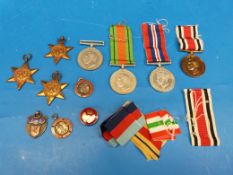A collection of WW2 medals comprising Africa Star, 39-45 Star, Italy Star and Defence medal (box