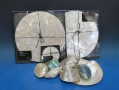 A collection of iridescent shell specimens and a collection of four boxed and unused Lapiz shell