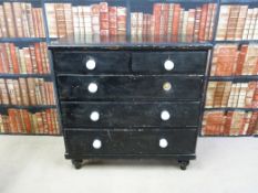 A 19thC black painted pine chest of two over three straight drawers