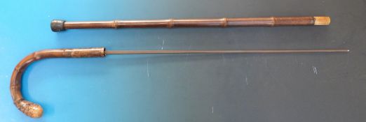 A bamboo sword stick with curved handle, with rectangular tapering section blade