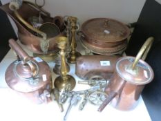 A collection of copper and brass ware including 19thC kettle, scuttle, cannon, guns etc