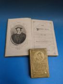 A 1937 brass money box celebrating the coronation of King George VI and Queen Elizabeth presented