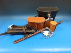 A horn handled riding crop, two pairs of spurs, leather bound showing canes, shooting stick,