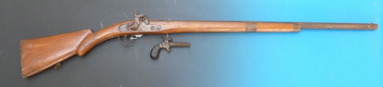 A small percussion pistol stamped FF and a replica percussion rifle