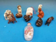 A collection of netsukes and similar items.