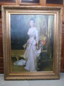 A large framed picture of a well dressed lady with fan