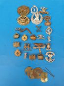 Twenty-six assorted British Army cap and collar badges including Highland, Queen's Own Yeomanry,
