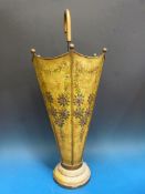 A metal stick stand in the shape of an umbrella