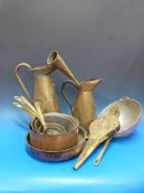 A quantity of copper and brass saucepans and other metalware