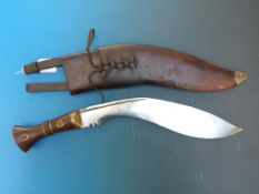 A kukri with marks to blade Co I I GII 1917 37 in leather sheath.