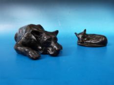 Two bronze coloured sculptures of German Shepherd dogs