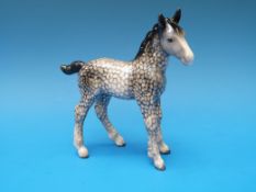A Beswick foal in dappled grey colourway.