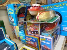 A collection of battery operated boats including Mickey's Motor boat, Captain Paddle-duck,