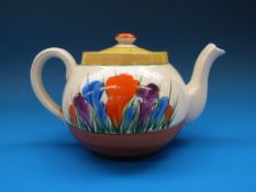 A small Clarice Cliff teapot, decorated in the 