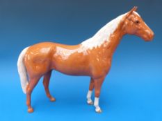 A large Beswick Hunter in dark palomino