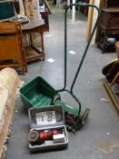 A Qualcast Panther 30 push cylinder mower and a Power Devil cased angle grinder