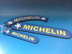 Three replica Michelin signs (the largest 39cm long)