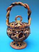 An unusual slipware openwork earthenware christening basket with rope twist handle (22cm high)
