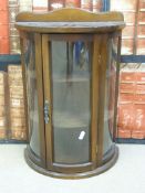 A small dome fronted display cabinet,