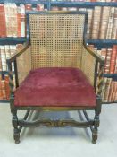 A bergere and oak armchair