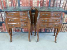 A pair of Louis XV style kingwood marble topped bombe commodes,