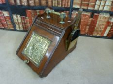 A 19thC mahogany and brass coal scuttle with shovel