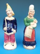 A pair of 19thC hollow figures of Punch and Judy (21.