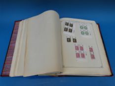 A large leather-bound album of stamps including GB with mint blocks 1953-75 and earlier mint stamps,