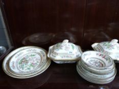 A quantity of Indian Tree pattern dinnerware comprising approximately 25 pieces in total