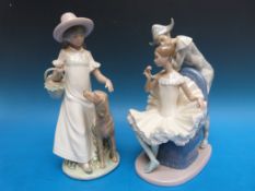 Two large Nao figures comprising Harlequin with ballet dancer and girl with dog (tallest 31cm)
