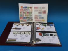 A stockbook of British and Colonial stamps and a GB first day cover album