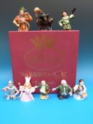 A set of eight boxed and certificate Bronte Porcelain 'The Wizard of Oz' candle snuffers