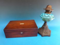 A mother of pearl inlaid writing slope and a cast oil lamp with blue bowl