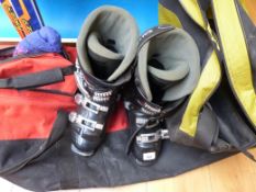 A set of skis and boots in bags