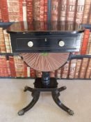 A Regency ebony and line inlaid sewing or worktable,