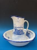 A blue and white transfer printed wash jug and basin with windmill decoration (32cm high)