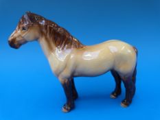 A Beswick Highland pony,
