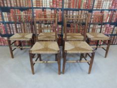 A set of six oak Arts and Crafts rush-seated dining chairs,