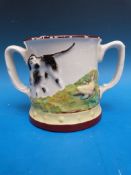 A large pottery frog mug with relief decoration of a spaniel / gun dog flushing and retrieving game