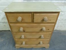 A small pine chest of two over three drawers (W65, D35,