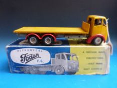 A Shackleton mechanical Foden FG Vehicle with spring motor, in yellow livery with red mud guards,