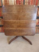 A Georgian mahogany tilt top table raised on tripod base (77 X 72cm)