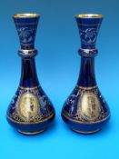 A pair of French Sevres style vases with pate-sur-pate style decoration and bust cartouches (27cm