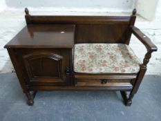 An oak telephone seat (W98, D44,