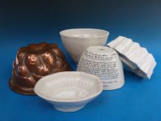 A collection of ceramic and copper jelly moulds including Shelley,