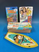A collection of plastic and tinplate model boats including clockwork and steam (pop-pop),